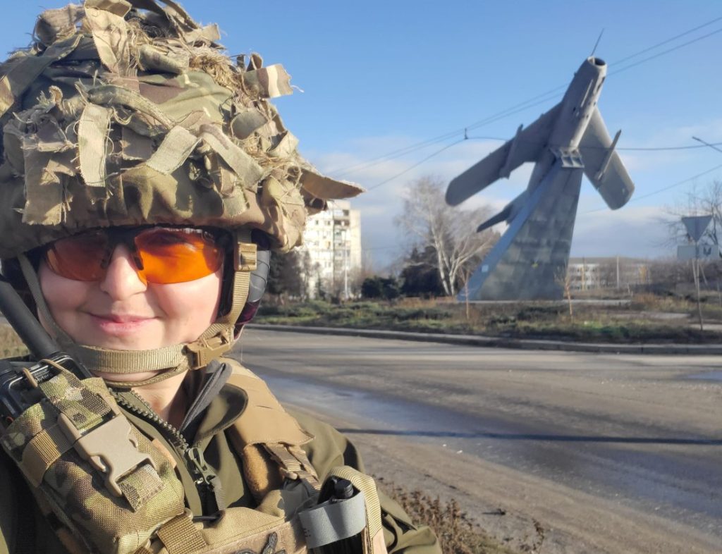 Photo: Maria Iskrovska, call sign Iskra (Spark), who has been fighting since 2014, near the MiG-17 aircraft monument in Bakhmut. The monument was recently destroyed. Courtesy: Maria Iskrovska