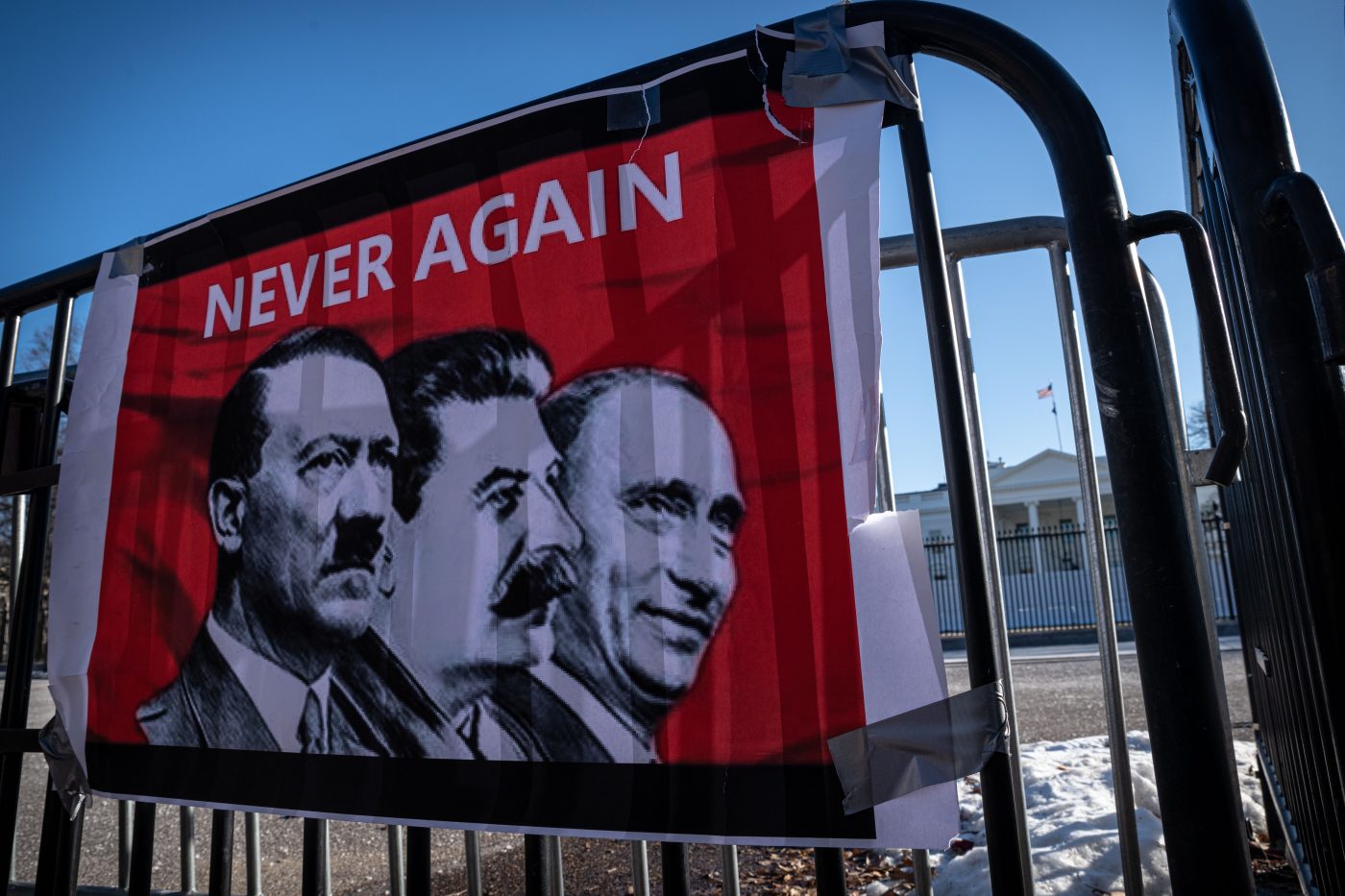 Photo: A sign likens Russian President Vladimir Putin to Joseph Stalin and Adolf Hitler outside the White House in Washington, D.C. on Jan. 29, 2022, during a rally seeking American support for Ukraine. Demonstrators called for the U.S. and its allies to support Ukraine in a potential Russian incursion by providing lethal military aid, axing the Nord Stream 2 pipeline project and severing Russia from the SWIFT payment system. Credit: Photo by Alejandro Alvarez/Sipa USA
