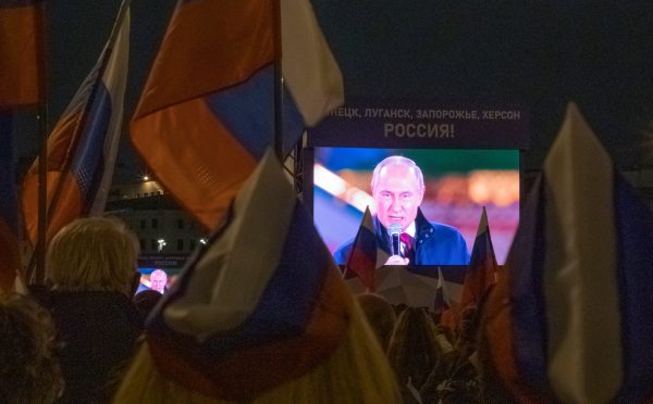 Photo: Russian President Vladimir Putin is seen on screens during a concert marking the declared annexation of the Russian-controlled territories of four Ukraine's Donetsk, Luhansk, Kherson and Zaporizhzhia regions, after holding what Russian authorities called referendums in the occupied areas of Ukraine that were condemned by Kyiv and governments worldwide, near the Kremlin and Red Square in central Moscow, Russia, September 30, 2022. A slogan on the screens reads: "Donetsk, Luhansk, Zaporizhzhia, Kherson - Russia!" Credit: REUTERS/REUTERS PHOTOGRAPHER