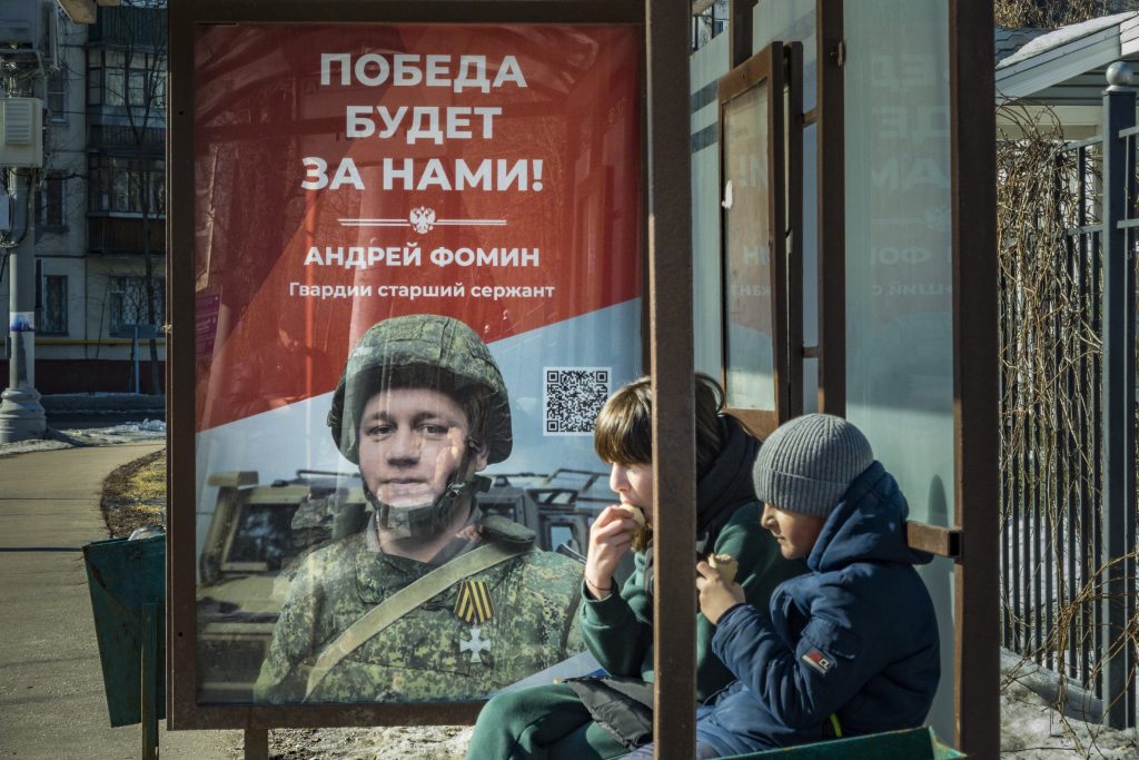 Photo: Huge banner in support of the Russian invasion of Ukraine in a bus stop of Moscow, on march 10, 2023. Banner says ''victory will be for us'' with the name and portrait of a killed soldier in the war, Andrei Fomin,, mayor sargent. Credit: Photo by Celestino Arce/NurPhoto