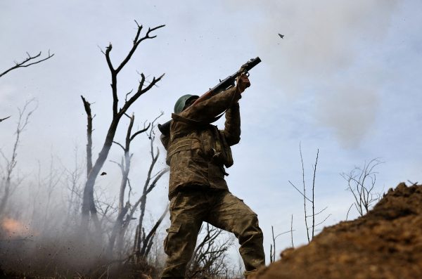Photo: Ukrainian service member from 28th mechanized brigade launches an RPG at the frontline, amid Russia’s attack on Ukraine in the region of Bakhmut, Ukraine, April 5, 2023. Credit: REUTERS/Kai Pfaffenbach