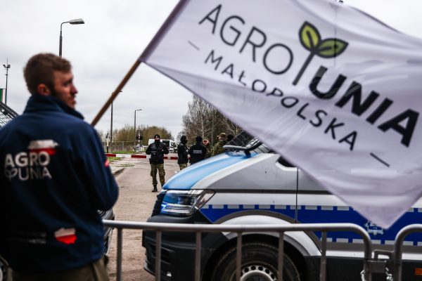 Photo: Farmers of Agrounia union organization protest near the rail line on the border with Ukraine in Hrubieszow, Poland on April 16, 2023. Polish farmers protest against Ukrainian agricultural products imports, which instead of being transported through Poland to the countries of destination, stays in the country and floods the market. Farmers understand a difficult situation caused by Russian invasion on Ukraine, but they urge the Polish government to regulate the imports. Poland’s government announced that the ban on imports would last until June 30. Credit: Photo by Beata Zawrzel/NurPhoto