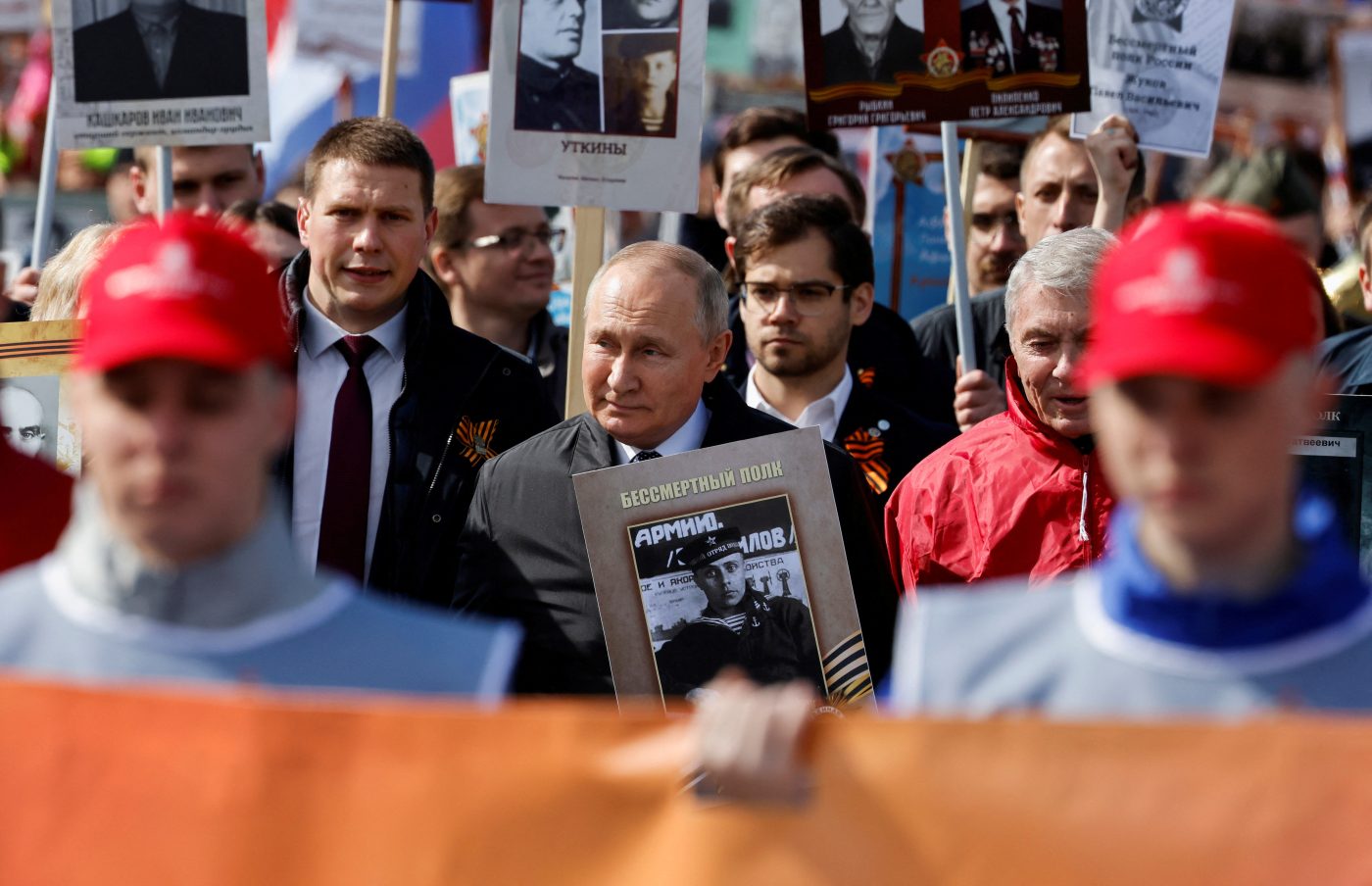 Photo: Russian President Vladimir Putin holds a portrait of his father, war veteran Vladimir Spiridonovich Putin, as he takes part in the Immortal Regiment march on Victory Day, which marks the 77th anniversary of the victory over Nazi Germany in World War Two, in central Moscow, Russia May 9, 2022. Credit: REUTERS/Maxim Shemetov/File Photo