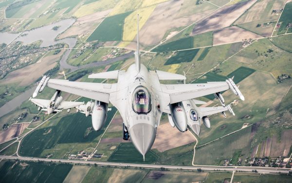 Photo: A Norwegian air force F-16 Fighter jet leads a formation during an air policing mission over the Baltics. Credit: NATO