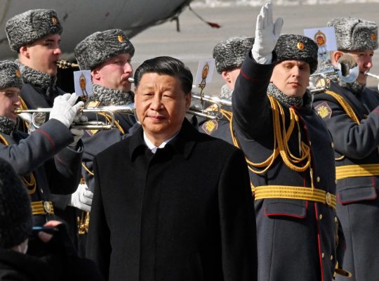 Photo: Chinese President Xi Jinping walks past honour guards and members of a military band during a welcoming ceremony upon his arrival at an airport in Moscow, Russia, March 20, 2023. Credit: Kommersant Photo/Anatoliy Zhdanov via REUTERS