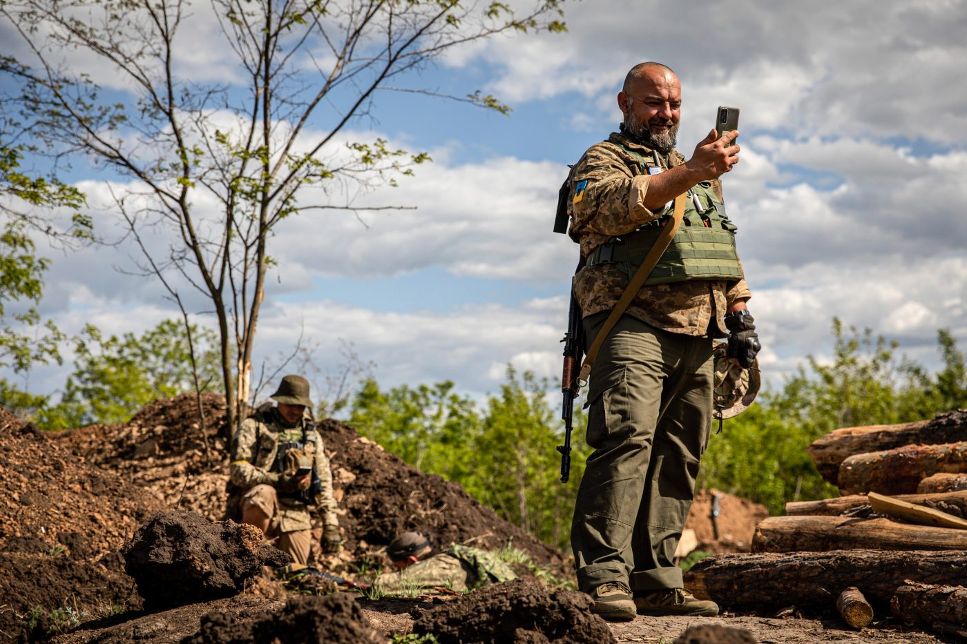 Photo: Soldier Maxim Varan video chats with his wife now taking refugee in Germany at an undisclosed defense position on the outskirt of the separatist region of Donetsk (Donbas). Credit: Alex Chan / SOPA Images/Sipa USA