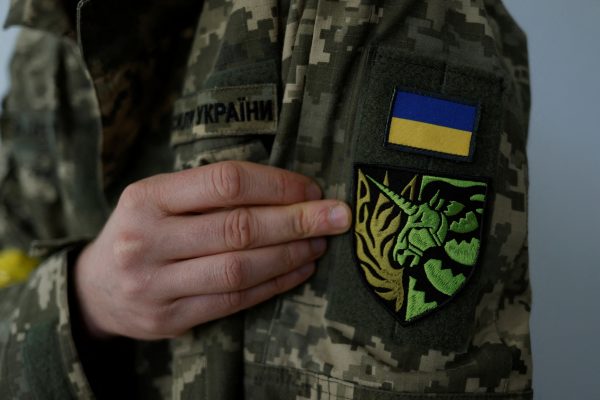 Photo: Ukrainian Territorial Defence member Antonina Romanova, 37, shows a unicorn insignia on their uniform symbolising the LGBTQ community, on the day of his departure to the frontline, as Russia's attack on Ukraine continues, at home in Kyiv, Ukraine May 25, 2022. Picture taken May 25, 2022. Credit: REUTERS/Edgar Su