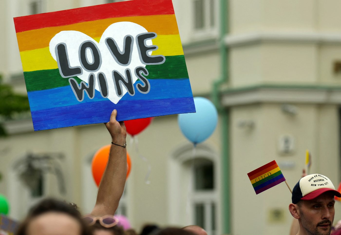 Photo: A man holds a placard during the Baltic Pride march for equality and peace in Vilnius, Lithuania June 4, 2022. Credit: REUTERS/Ints Kalnins