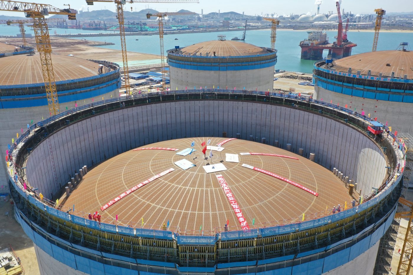 Photo: YANTAI, CHINA - APRIL 26, 2023 - An LNG tank is hoisted at the construction site of an LNG receiving station in the Xigang area of Yantai Port, Shandong Province, China, April 26, 2023. On April 26, 2023, the five 200,000 cubic meter storage tanks of the Xigang Area liquefied natural gas (LNG) receiving terminal project at Yantai Port in Shandong Province were completed, marking the transfer of the construction phase of the storage tanks from civil construction to installation. The LNG receiving station project is a key implementation project of the National Implementation Plan for the Construction of Liquefied Natural Gas Storage and Transportation System in the Bohai Rim Region. Upon completion, it will provide energy security for Shandong, Bohai Rim and even North China in a sustainable and stable manner, and enhance regional peak regulation, gas storage and winter supply protection capabilities. Credit: Photo by CFOTO/Sipa USA