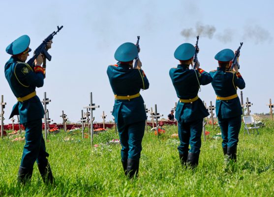 Photos: Guards of honor fire weapons during a funeral ceremony to bury the remains of sixty service members of the Russian armed forces and three civilians, who were killed in the course of Russia-Ukraine conflict, at a cemetery in Luhansk, Russian-controlled Ukraine, May 18, 2023. Credit: REUTERS/Alexander Ermochenko