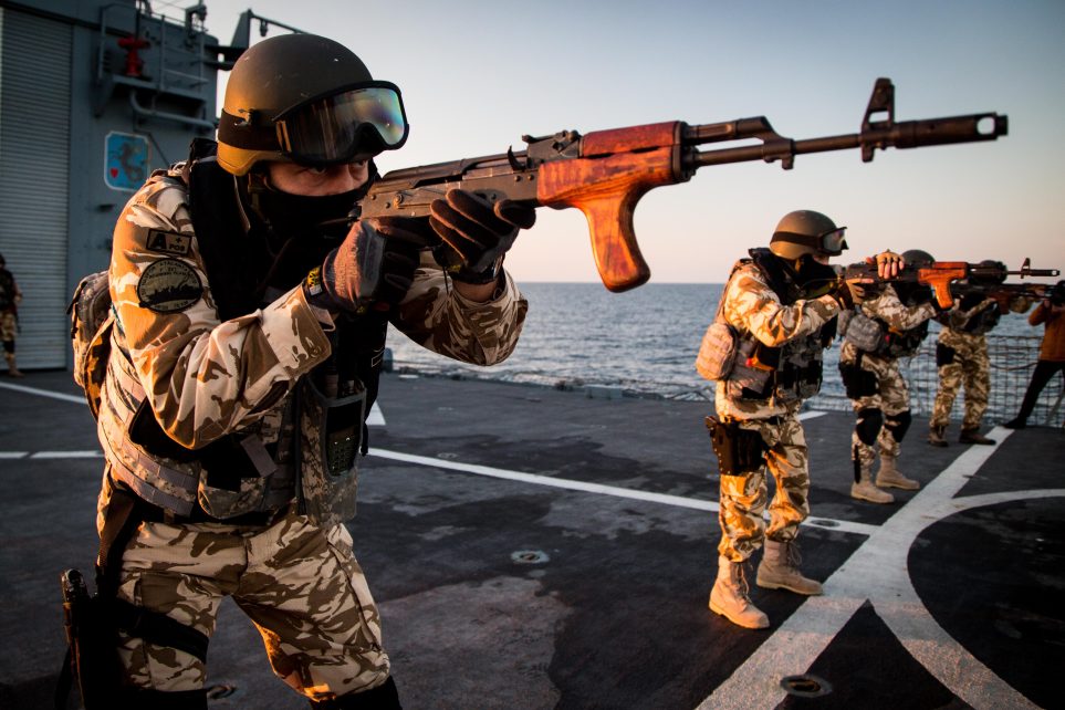 Photo: Romanian navy boarding team takes aim during weapons drills on the rear deck of the Romanian frigate Regele Ferdinand in the Black Sea during manoeuvres with Standing NATO Maritime Group 2 (SNMG2). Credit: https://flic.kr/p/21Li9Uw