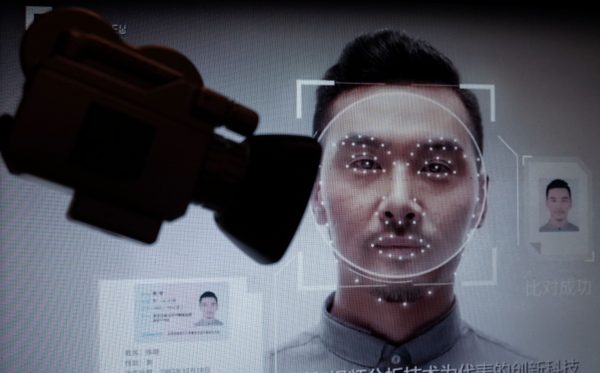 Photo: February 03, 2020: Illustration of China's facial-recognition technology with the silhouette of a mock video camera in front of screen grabs taken from a promotional video by Megvii. Megvii is a Beijing-based Chinese technology company that designs image recognition and deep-learning software, whose Face++ product is used by Chinese security authorities. Photo d'illustration de la technologie de reconnaissance faciale en Chine. Credit: Mehdi Chebil