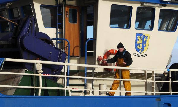 Photo: A fisherman aboard a vessel after docking in the fishing village of Howth, Dublin. Irish coastal communities will be ÒannihilatedÓ if BritainÕs post-Brexit fishing demands are granted, an Oireachtas committee has been told. Credit: PA via Reuters
