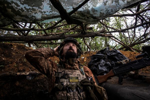 Photo: A Ukrainian serviceman looks up from a trench for a possible drone at a position near the frontline town of Bakhmut, amid Russia's attack on Ukraine, in Donetsk region, Ukraine May 30, 2023. Credit: REUTERS/Yevhenii Zavhorodnii