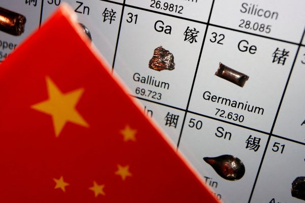Photo: The flag of China is placed next to the elements of Gallium and Germanium, used in chip manufacturing, on a periodic table, in this illustration picture taken on July 6, 2023. Credit: REUTERS/Florence Lo/File Photo