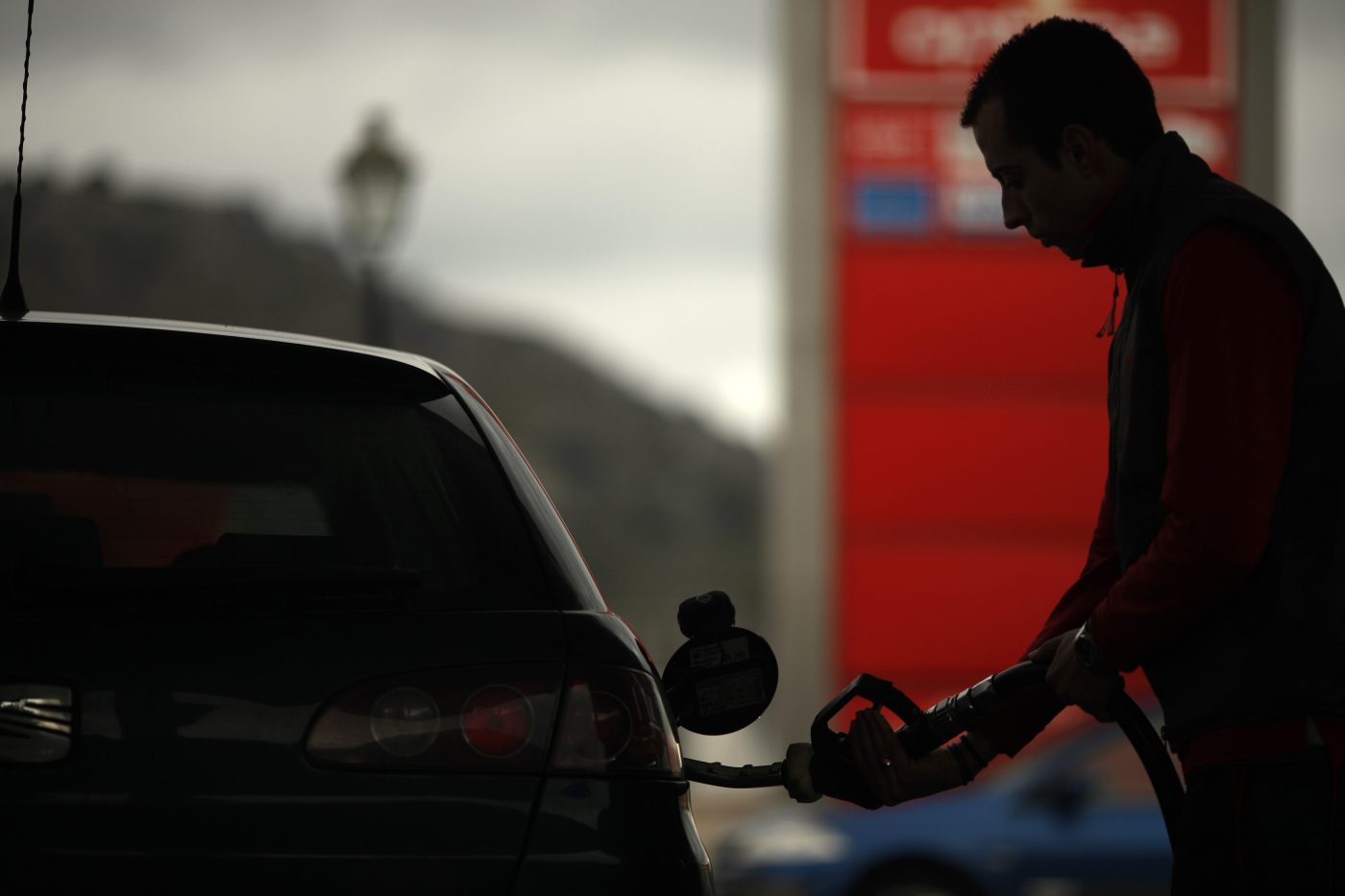 Photo: A worker pumps petrol into a customer's car at a petrol station in Cuevas del Becerro, near Malaga, southern Spain March 4, 2011. Credit: REUTERS/Jon Nazca