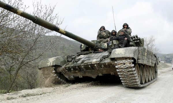 Photo: A tank of the self-defense army of Nagorno-Karabakh moves on the road near the village of Mataghis April 6, 2016. Credit: REUTERS/Staff