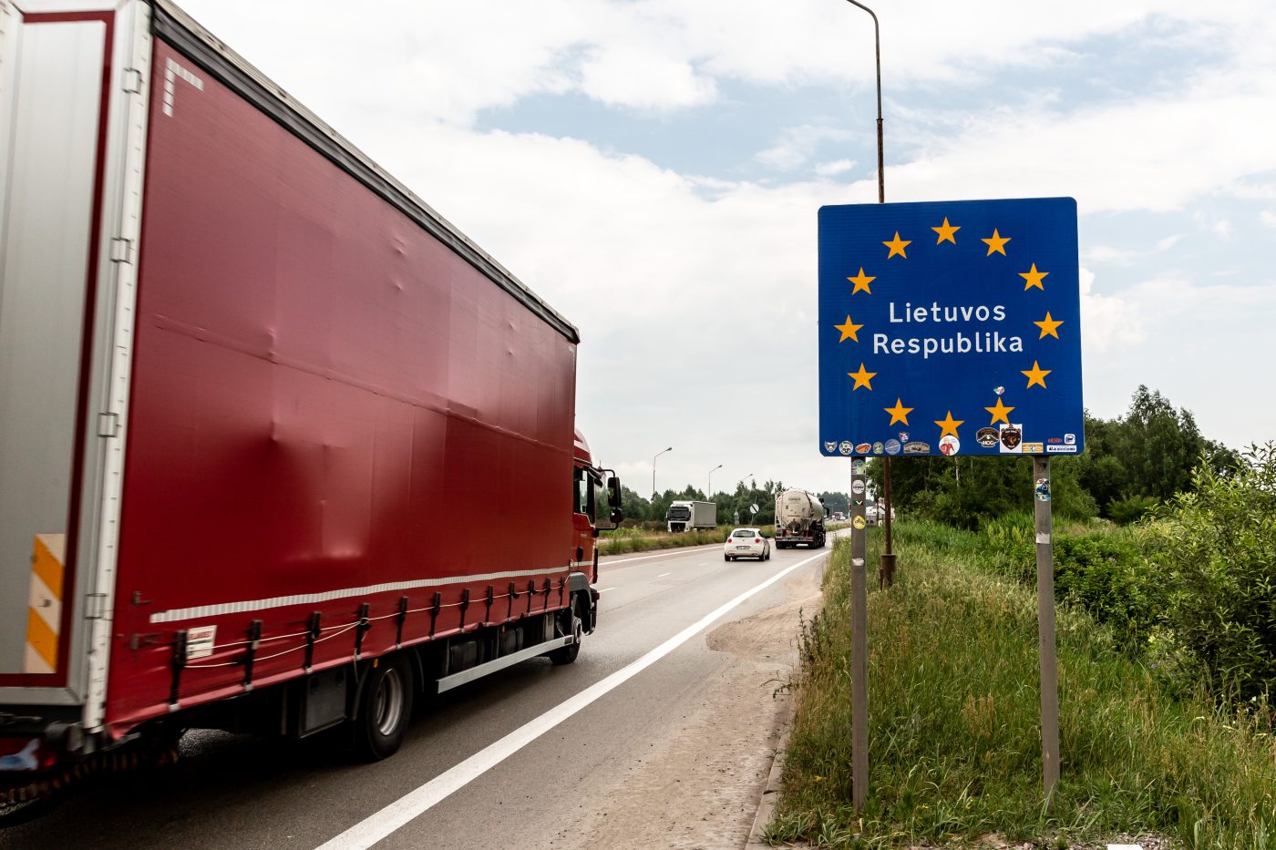 Photo: A lorry with goods passes the Lithuanian border sign to enter Lithuania on June 29, 2022 at Polish-Lituanian border on the busy E67 road. The Polish border with Lithuania is situated between Kaliningrad oblast (part of Russia) and Belarus and stretches 100 kilometers. The Area is called Suwalki Gap and is the only connection between Baltic States and the rest of the NATO and European Union. After Lithuania refused to transport sanctioned goods via rail from Russia's mainland to Kaliningrad, Vladimir Putin, Russian president, threatened Lithuania with serious consequences. Both NATO and European Union worry that Suwalki Gap, a relatively narrow corridor with Baltic States can be attacked by Russia. Credit: Photo by Dominika Zarzycka/NurPhoto