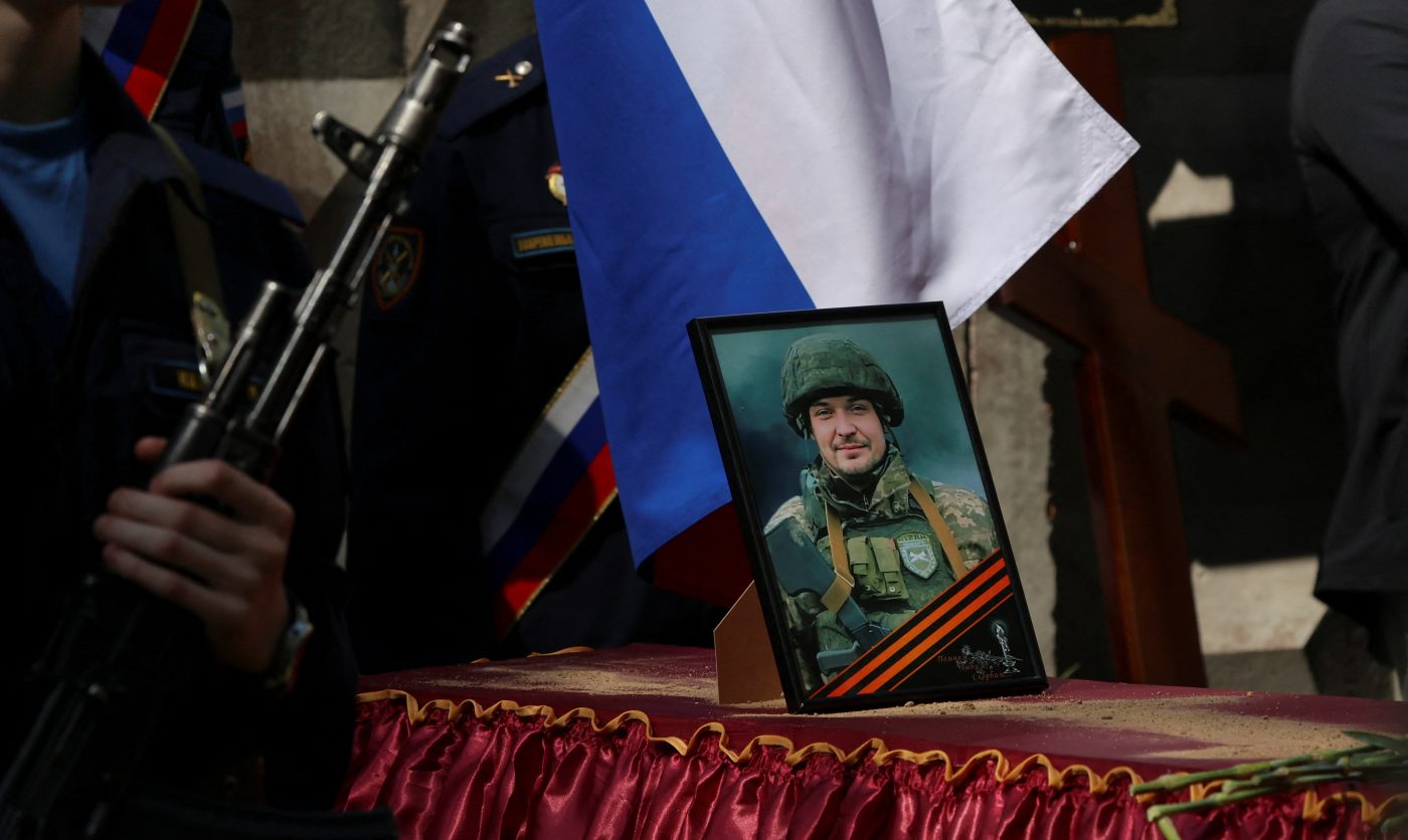 Photo: Honor guards stand next to a coffin during the funeral of Alexander Skobelev, junior sergeant of the Russian armed forces killed in the course of Russia-Ukraine conflict, at a cemetery in the town of Shlisselburg in the Leningrad region, Russia, June 8, 2023. Credit: REUTERS/Anton Vaganov