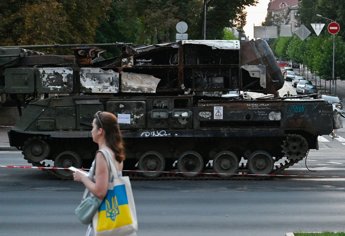 Photo: A woman walks past destroyed equipment of the Russian army, exhibited on Khreshchatyk in the center of Kyiv for the Independence Day of Ukraine. Ukrainians will celebrate the 32nd anniversary of Independence Day on August 24, 2023 Credit: Photo by Sergei Chuzavkov / SOPA Images/Sipa USA