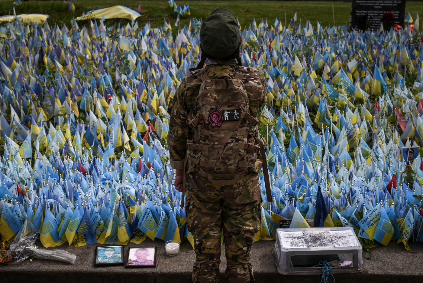 Photo: A Ukrainian service member pays her respects to fallen comrades in front of a memorial dedicated to Ukrainian Servicemembers killed in combat, in the city center of Kyiv on August 24, 2023. Ukrainians gather to celebrate Ukraine's Independence Day at a display of destroyed Russian military vehicles and captured Russian military equipment on the historic Khreschatyk Street in the city center of Kyiv. Credit: Photo by Justin Yau/ Sipa USA