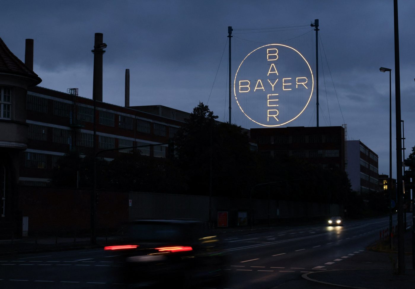 Photo: The 120 metres high Bayer Cross, logo of German pharmaceutical and chemical maker Bayer AG, consisting of 1710 LED glass bulbs is seen outside the industrial park "Chempark" of the chemical industry in Leverkusen, Germany, September 23, 2023. Credit: REUTERS/Wolfgang Rattay