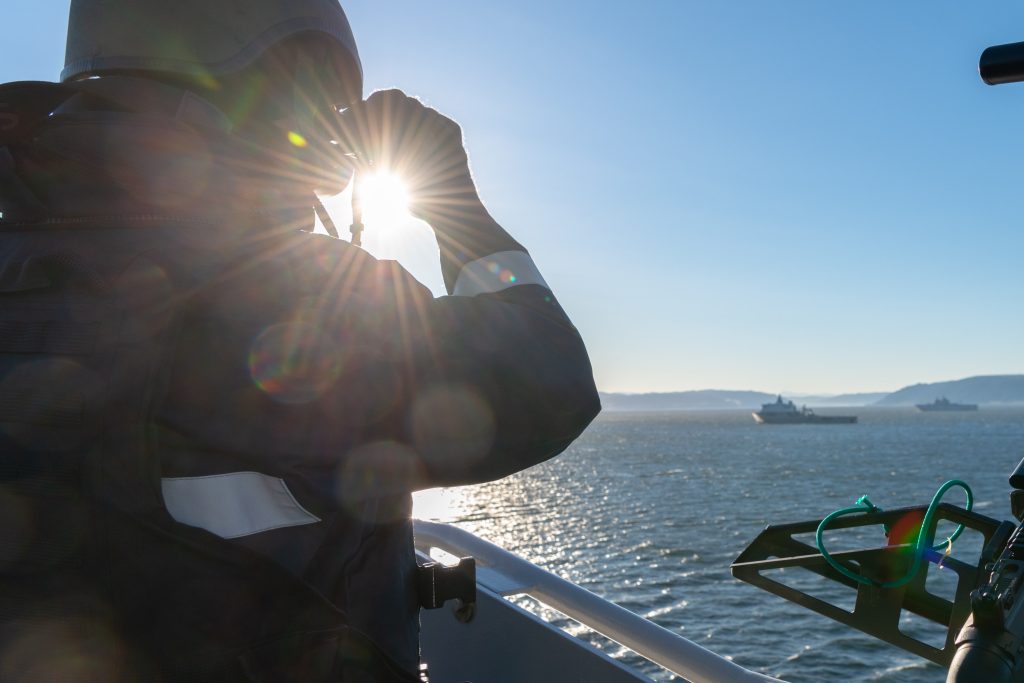 A Force Protection member from HNLMS Johan de Witt gives a look-out during Trident Juncture Amphibious DV Day Rehearsal. Credit NATO via Flickr.