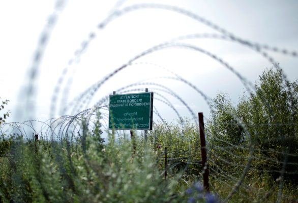 Photo: A border sign is seen behind the barbed wire at the de facto Russian border of Georgia's breakaway region of South Ossetia in Khurvaleti, Georgia, June 18, 2018. Picture taken June18, 2018. Credit: REUTERS/David Mdzinarishvili