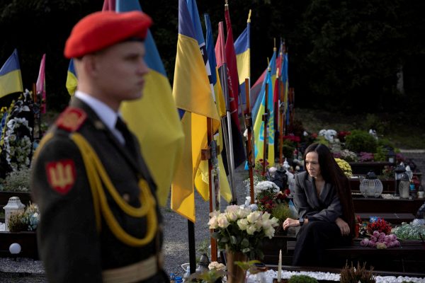 Photo: Iryna Marion mourns her fallen husband Oleksander Alimov at his grave in the Field of Mars military cemetery as Ukraine marks Defenders' Day, honouring soldiers who died fighting Russia's ongoing invasion, in Lviv, Ukraine, October 1, 2023. Credit: REUTERS/Thomas Peter