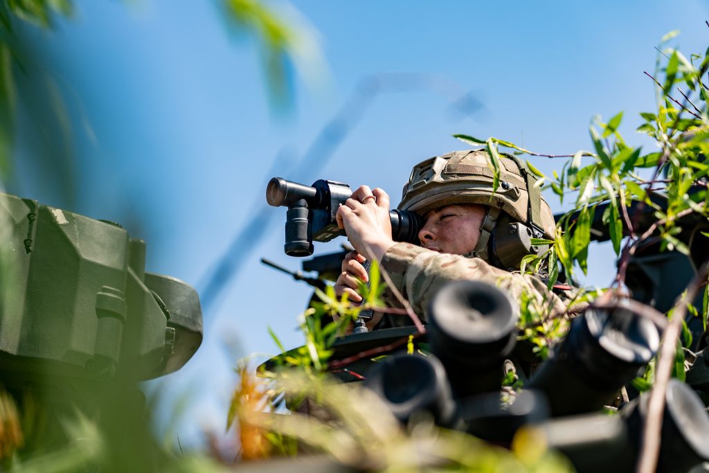 Photo: A UK artillery soldier scans the area from their armoured vehicle during exercise Ramstein Legacy 22. Credit: NATO