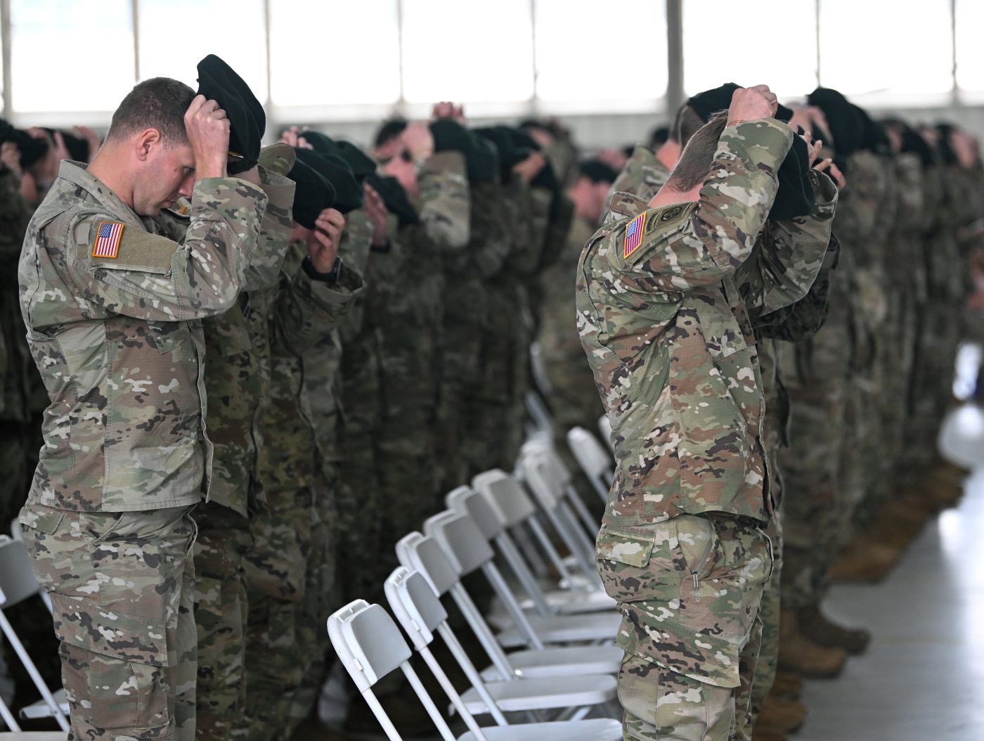 Photo: Soldiers assigned to the U.S. Army John F. Kennedy Special Warfare Center and School don their green berets for the first time during a Regimental First Formation at Fort Liberty, North Carolina October 12, 2023. The ceremony marked the completion of the Special Forces Qualification Course where Soldiers earned the honor of wearing the green beret, the official headgear of Special Forces. Credit: U.S. Army photo by K. Kassens via dvids
