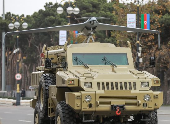 Photo: An Azeri army armored vehicle with mounted Unmanned Aerial Vehicles (UAV) drives during the parade to mark the victory in the Nagorno-Karabakh conflict in Baku, Azerbaijan December 10, 2020. Credit: REUTERS/Aziz Karimov