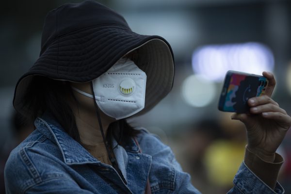 Photo: A person wearing a face mask looks at a mobile phone on a street in Beijing, China, October 31, 2023. The Municipal Air Pollution Emergency Headquarters in Beijing issued an orange warning, the second-highest alert for heavy air pollution, from 30 October to 02 November. The real-time air quality index on 31 October was at 183, unhealthy. PM2.5 concentration in Beijing is currently 21.5 times more than the WHO annual air quality guideline value. Credit: Matrix Images / Jiwei Han No Use Austria. No Use Germany. No Use Switzerland.