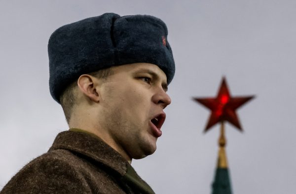 Photo: A participant performs on a stage, with a star of the Kremlin seen in the background, during an exhibition marking the anniversary of a historical parade in 1941, when Soviet soldiers marched towards the front lines in the course of World War Two, in Red Square in Moscow, Russia, November 7, 2023. Credit: REUTERS/Maxim Shemetov