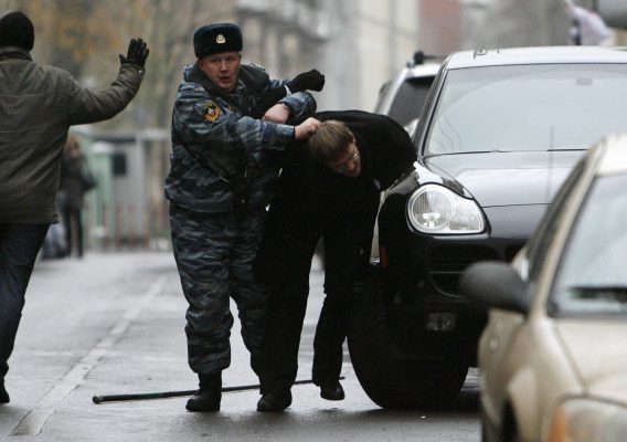 Photo: A police officer arrests an opposition supporter during an opposition rally in central Moscow, November 24, 2007. Russia's police detained opposition leader and former world chess champion Garry Kasparov and several other anti-Kremlin protesters on Saturday as they demonstrated against President Vladimir Putin. Credit: REUTERS/Denis Sinyakov (RUSSIA)