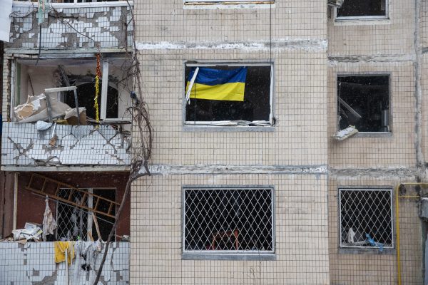 Photo: The flag of Ukraine is being seen through one of the broken windows of a residential building that is partly destroyed after a missile attack in Kyiv, Ukraine, on January 3, 2024. Following the shelling of Kyiv on January 2, 2024, this residential building in one of the city's districts has suffered significant damage. Rescuers report that 7 apartments in the building have been completely burned down, and more than 300 homes have been damaged. Credit: Oleksandr Khomenko/NurPhoto
