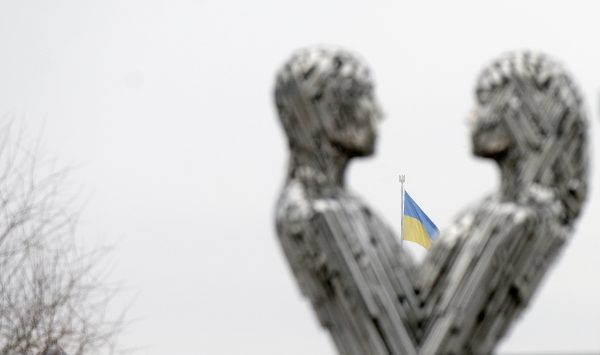 Photo: KYIV, UKRAINE - JANUARY 06, 2024 - The national flag of Ukraine is seen between the male and female figures of the Unity sculptural composition by Ukrainian artists Yehor and Mykyta Zihura on Dnipro embankment, Kyiv, capital of Ukraine. Credit: Photo by Ruslan Kanuka/Ukrinform/Sipa USA
