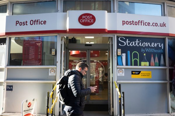 Photo: A man walks past a Post Office branch in Westminster, London. The British government has announced a new law that will exonerate wrongly convicted sub-postmasters caught up in the Post Office scandal. Credit: (Photo by Tejas Sandhu / SOPA Images/Sipa USA)No Use Germany.