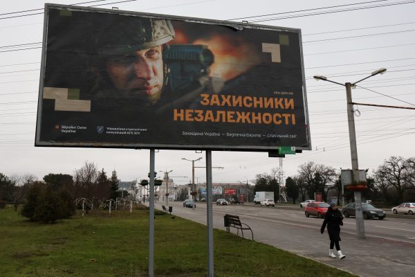 Photo: A woman walks past the recruitment billboard for the Ukrainian armed forces in the center of Zaporizhzhia. Ukraine's army is running short on personnel as its war with Russia drags on. In an effort to make military service more palatable, the government is overhauling its recruitment policy. According to the Defense Ministry, Ukraine will use a people-centered approach to develop an effective system for recruiting professional and motivated personnel for the armed forces. Credit: Photo by Andriy Andriyenko / SOPA Images/Sipa USA
