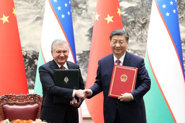 Photo: Chinese President Xi Jinping and Uzbekistan's President Shavkat Mirziyoyev shake hands at a signing ceremony at the Great Hall of the People in Beijing, China January 24, 2024. The agreement focuses on growing Chinese Influence in Central Asia. Credit: Stringer/cnsphoto via REUTERS.