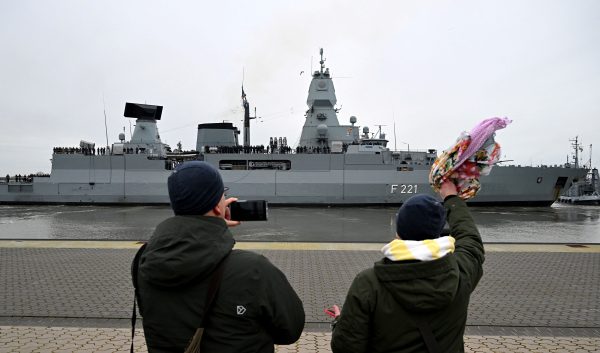 Photo: People wave and take pictures as the frigate "Hessen" is sent off to the Red Sea from Wilhelmshaven, Germany, February 8, 2024, subject to an EU and national mandate, it will participate in the international EUNAVFOR ASPIDES mission to protect shipping and ensure freedom of navigation in the Red Sea. Credit: REUTERS/Carmen Jaspersen