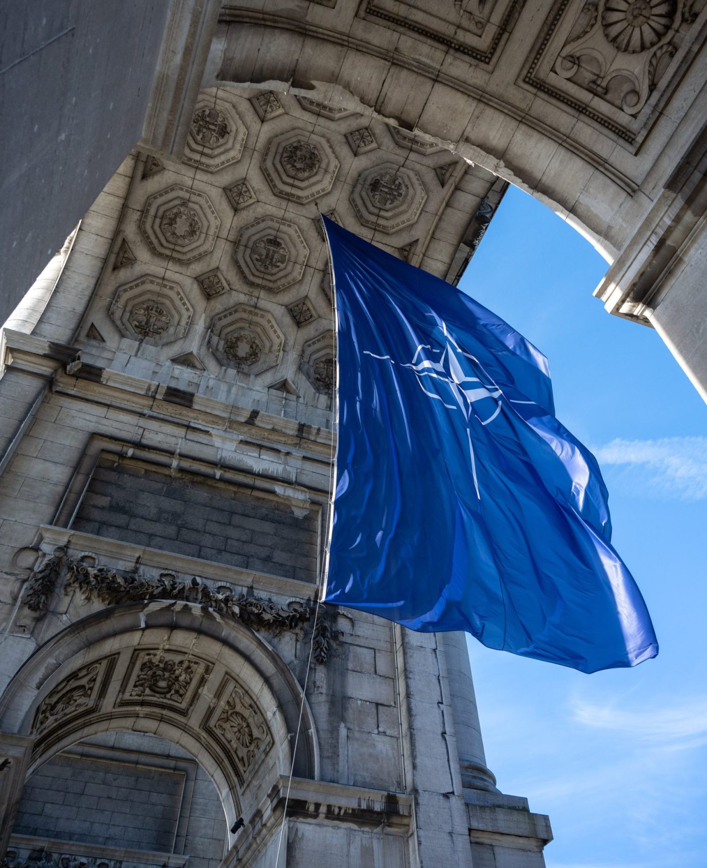 Photo: NATO Flag at the Arches of the Cinquantenaire in Brussels for the occasion of NATO Day. Credit: NATO