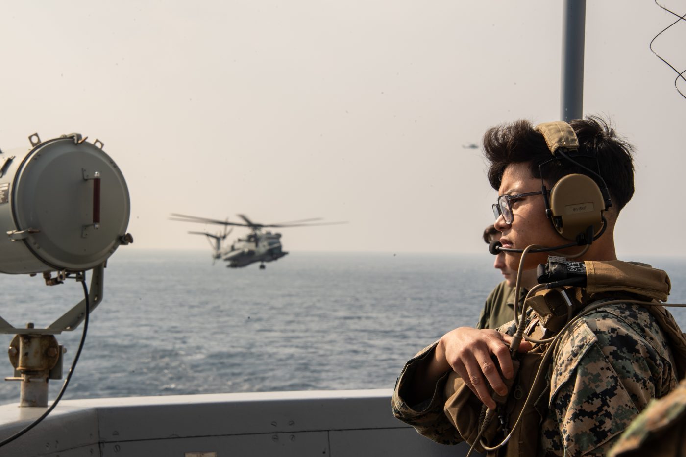 Photo: (Feb. 11, 2024) U.S. Marine Corp Cpl. Ethan Sumineg, from Bakersfield, assigned to the 31st Marine Expeditionary Unit as a field radio operator maintains communications aboard the forward-deployed amphibious landing dock ship USS Green Bay (LPD 20) during a Visit, Board, Search and Seizure (VBSS) exercise. Green Bay, part of the America Amphibious Ready Group, along with the 31st MEU, is operating in the U.S. 7th Fleet area of operations. U.S. 7th Fleet is the U.S. Navy’s largest forward-deployed numbered fleet, and routinely interacts and operates with allies and partners in preserving a free and open Indo-Pacific region. Credit: U.S. Navy photo by Mass Communication Specialist 2nd Class Matthew Bakerian via dvids https://www.dvidshub.net/image/8244699/uss-green-bay-lpd-20-conducts-vbss-exercise