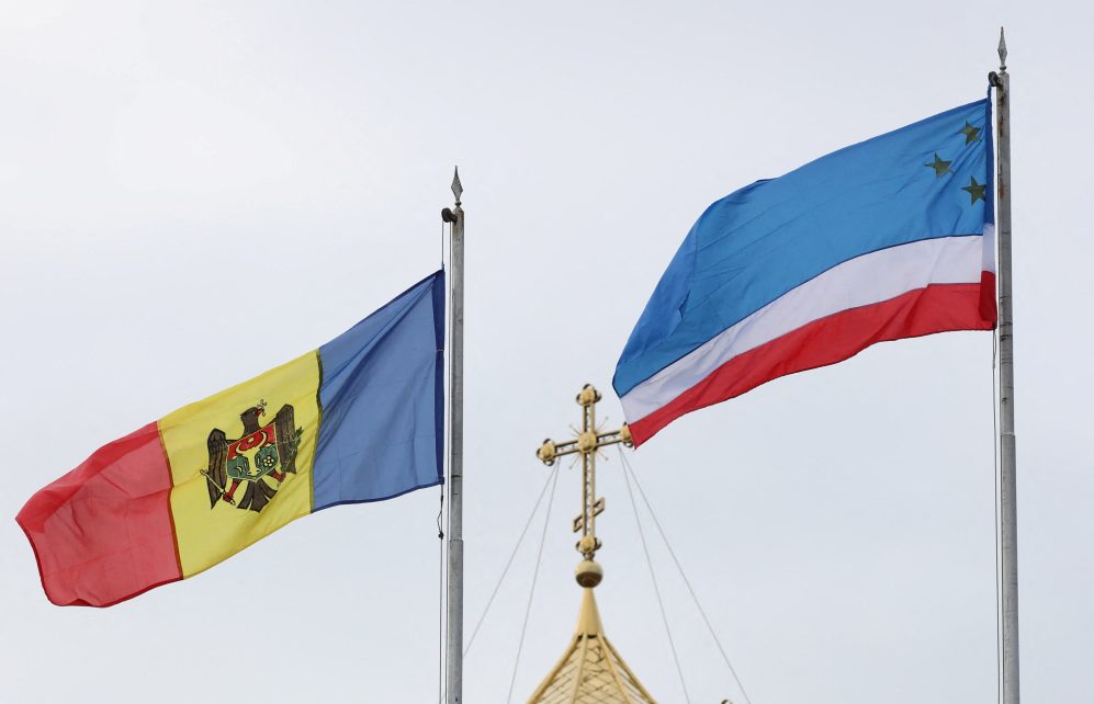 Photo: Flags of Moldova and the autonomous region of Gagauzia fly next to a church in Comrat, the capital of the autonomous region of Gagauzia, Moldova March 2, 2023. Credit: REUTERS/Vladislav Culiomza