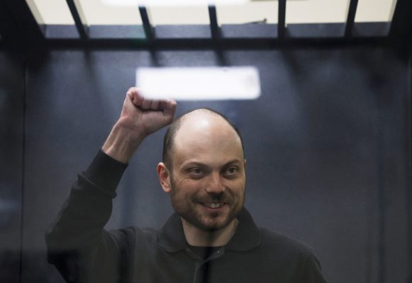 Photo: Jailed Russian opposition figure Vladimir Kara-Murza gestures as he stands behind a glass wall of an enclosure for defendants during a court hearing to consider an appeal against his prison sentence, in Moscow, Russia July 31, 2023. Credit: REUTERS/Maxim Shemetov