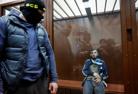 Photo: Dalerdzhon Mirzoyev, a suspect in the shooting attack at the Crocus City Hall concert venue, sits behind a glass wall of an enclosure for defendants at the Basmanny district court in Moscow, Russia March 24, 2024. Credit: REUTERS/Shamil Zhumatov