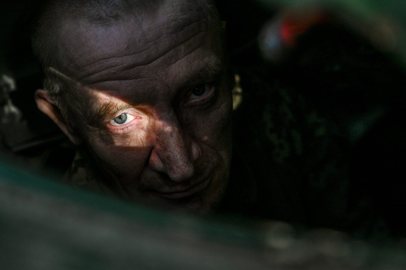 Photo: The sun is highlighting the eye of a serviceman from the 1st Tank Brigade of the Ukrainian Ground Force in Ukraine, on March 31, 2024. Credit: Ukrinform/NurPhoto.