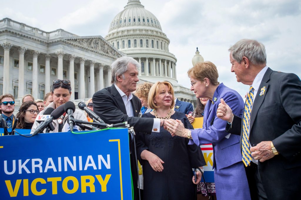 Photo: Former Ukrainian President Viktor Yushchenko, left, is greeted by United States Representative Marcy Kaptur (Democrat of Ohio), second from right, and United States Representative Joe Wilson (Republican of South Carolina), right, after offering remarks on a Ukrainian Victory Resolution during a press conference a the US Capitol in Washington, DC, Tuesday, April 25, 2023. Credit: Rod Lamkey/CNP