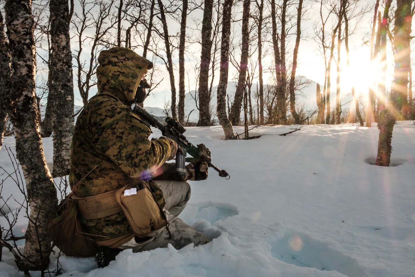 Photo: A US Marine stands sentry near Moen, Norway as part of Exercise White Claymore in February 2018. During the exercise, Marines with Marine Rotational Force-Europe honed their winter warfare skills with UK Royal Marines with 45 Commando. Credit: NATO Flickr