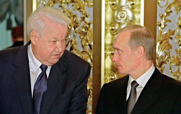 Photo: THE GRAND KREMLIN PALACE, MOSCOW. President Putin with Boris Yeltsin, the first Russian President, at a state reception dedicated to the Day of Russia. Credit: Presidential Press and Information Office via Wikimedia Commons https://commons.wikimedia.org/wiki/File:Vladimir_Putin_12_June_2001-2.jpg